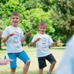 a group of young boys playing a game of frisbee