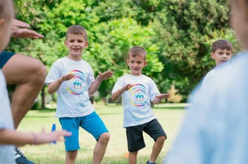 a group of young boys playing a game of frisbee